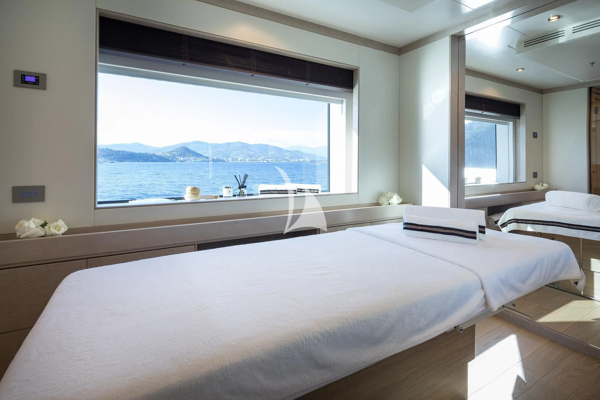 a room with a large bed and a window aboard TRIUMPH Yacht for Sale