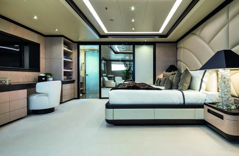 a large room with a bed and a couch aboard TRIUMPH Yacht for Sale