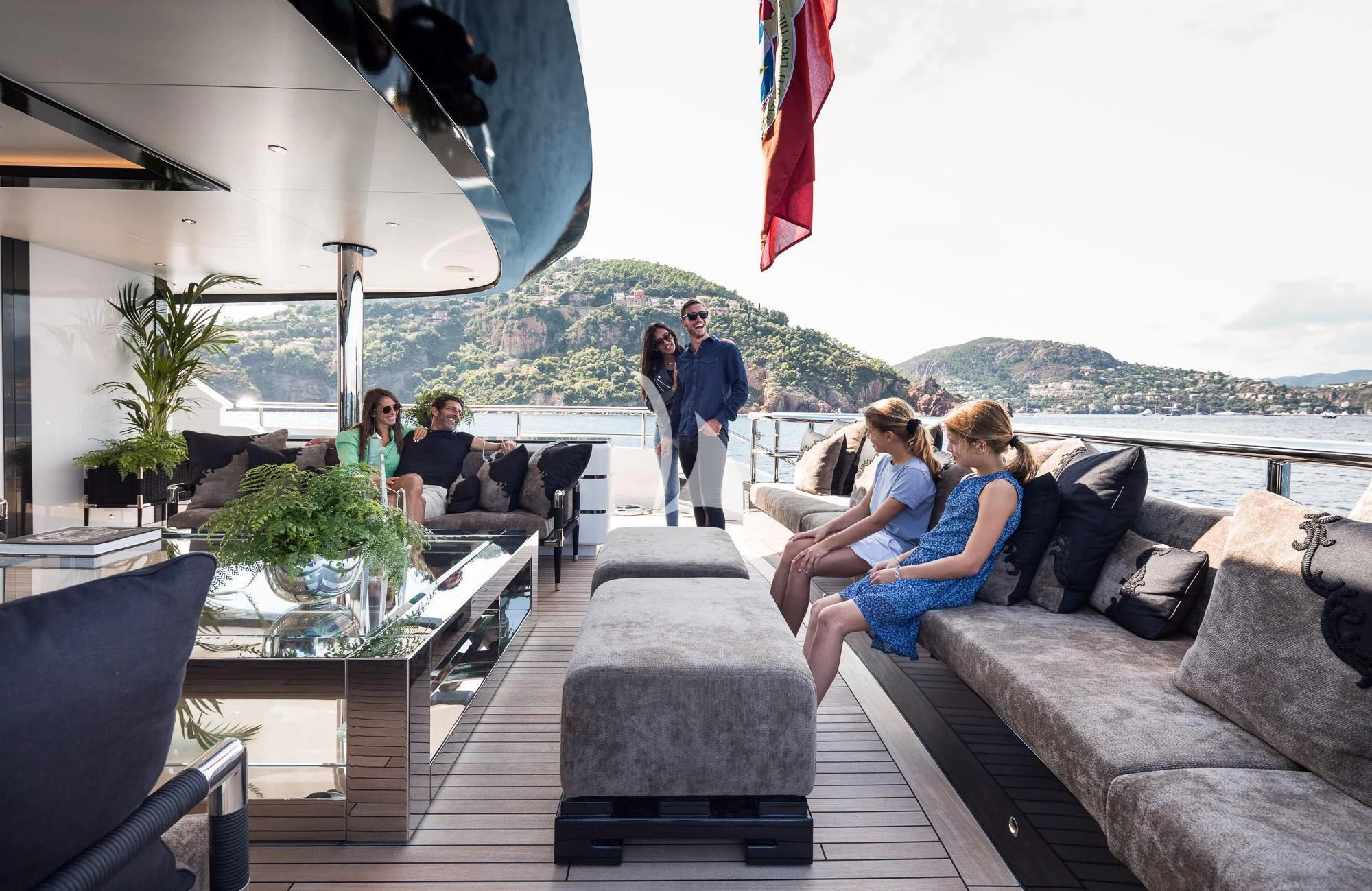 people sitting on a deck aboard TRIUMPH Yacht for Sale