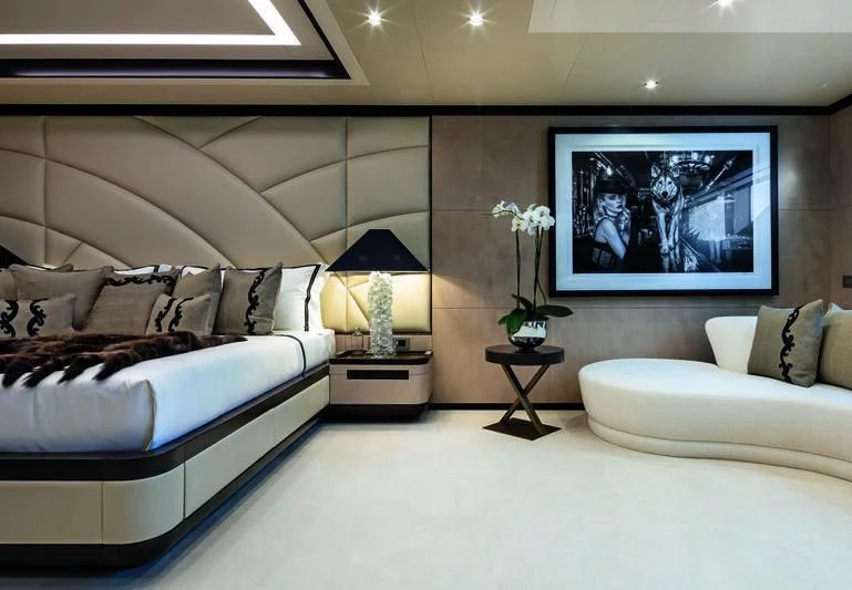 a living room with a large screen aboard TRIUMPH Yacht for Sale