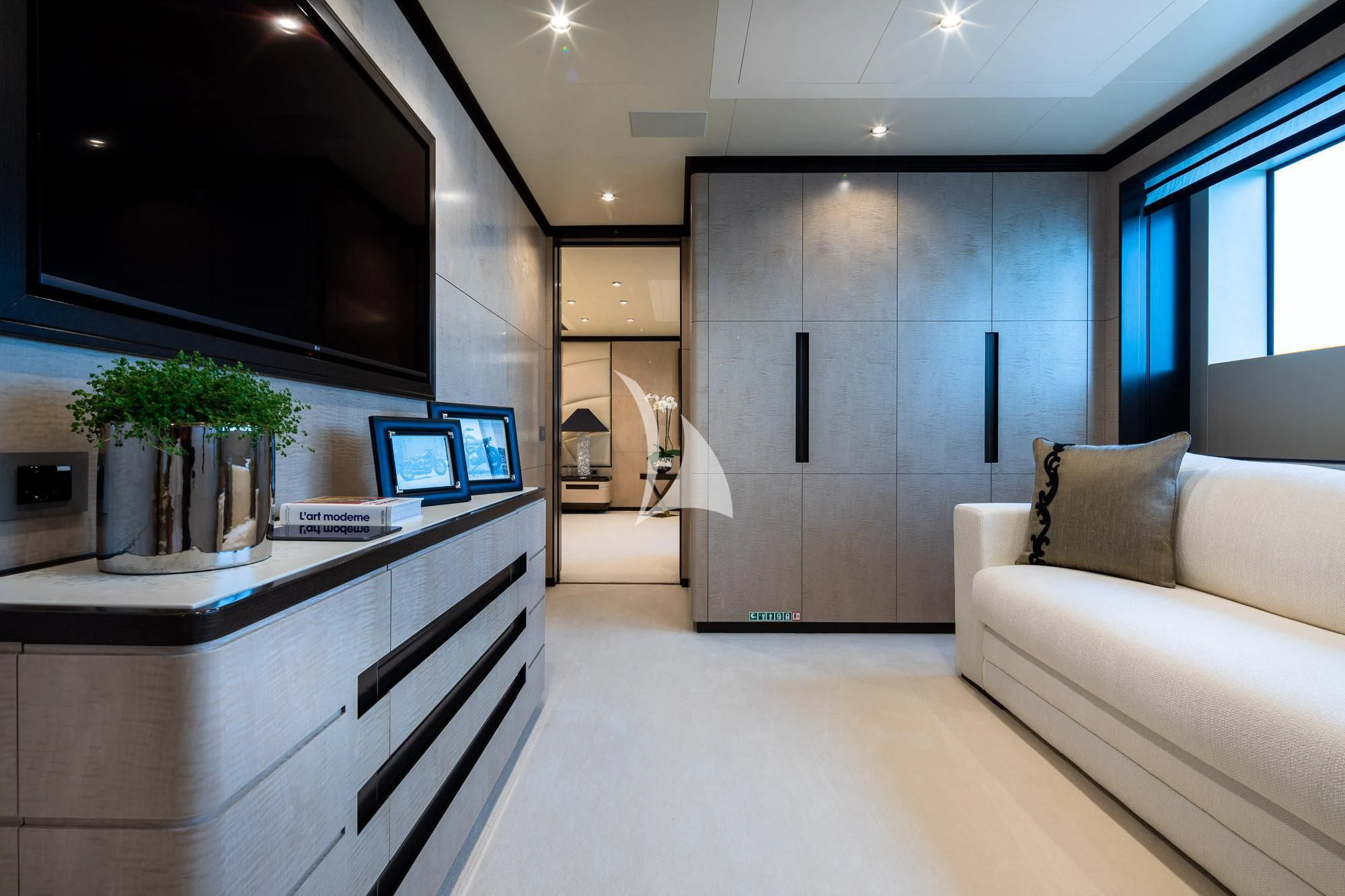 a room with a couch and a tv aboard TRIUMPH Yacht for Sale