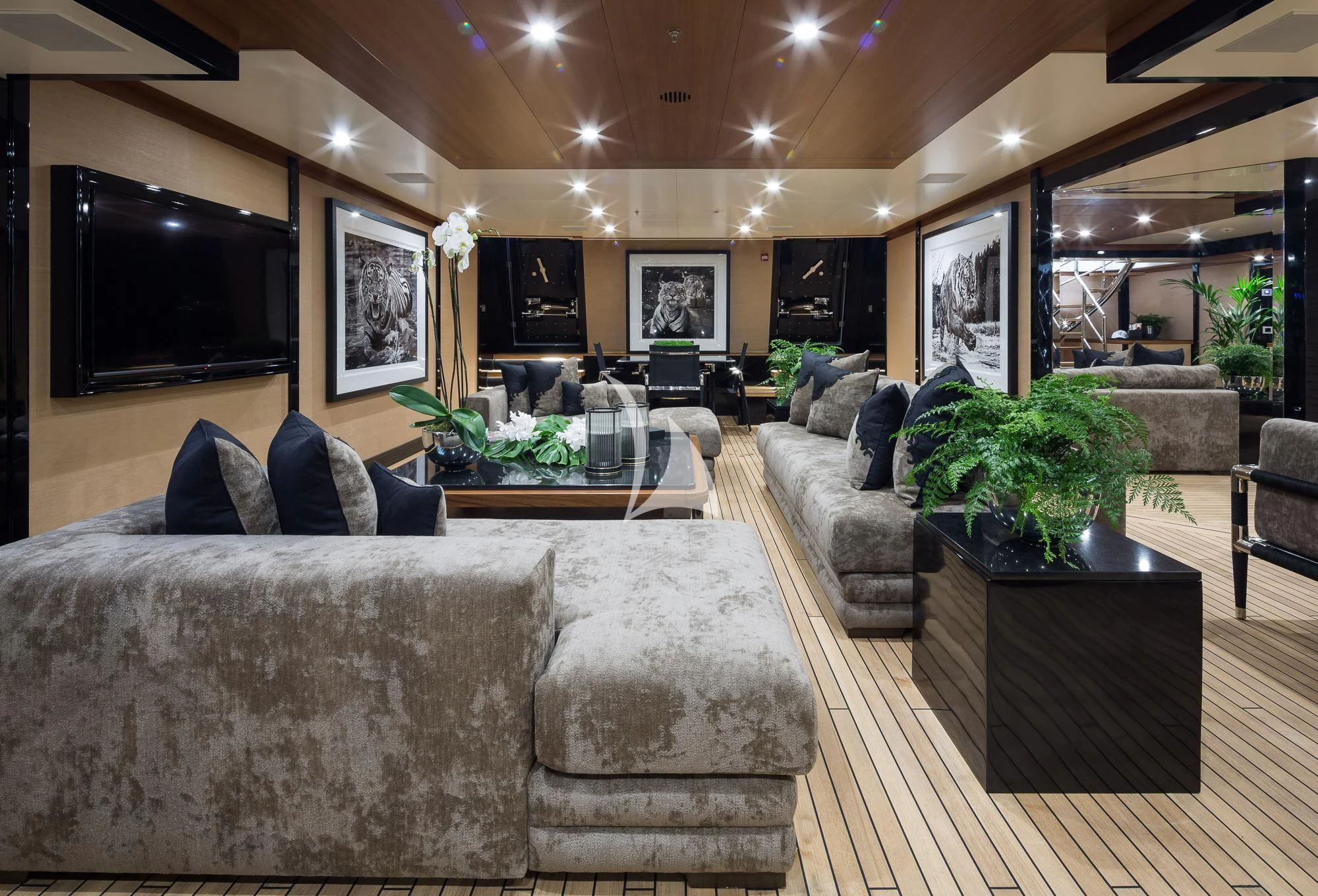 a living room with a large screen aboard TRIUMPH Yacht for Sale
