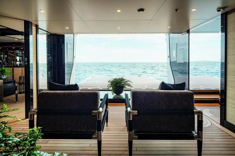 a room with a view of the ocean and a large window aboard TRIUMPH Yacht for Sale