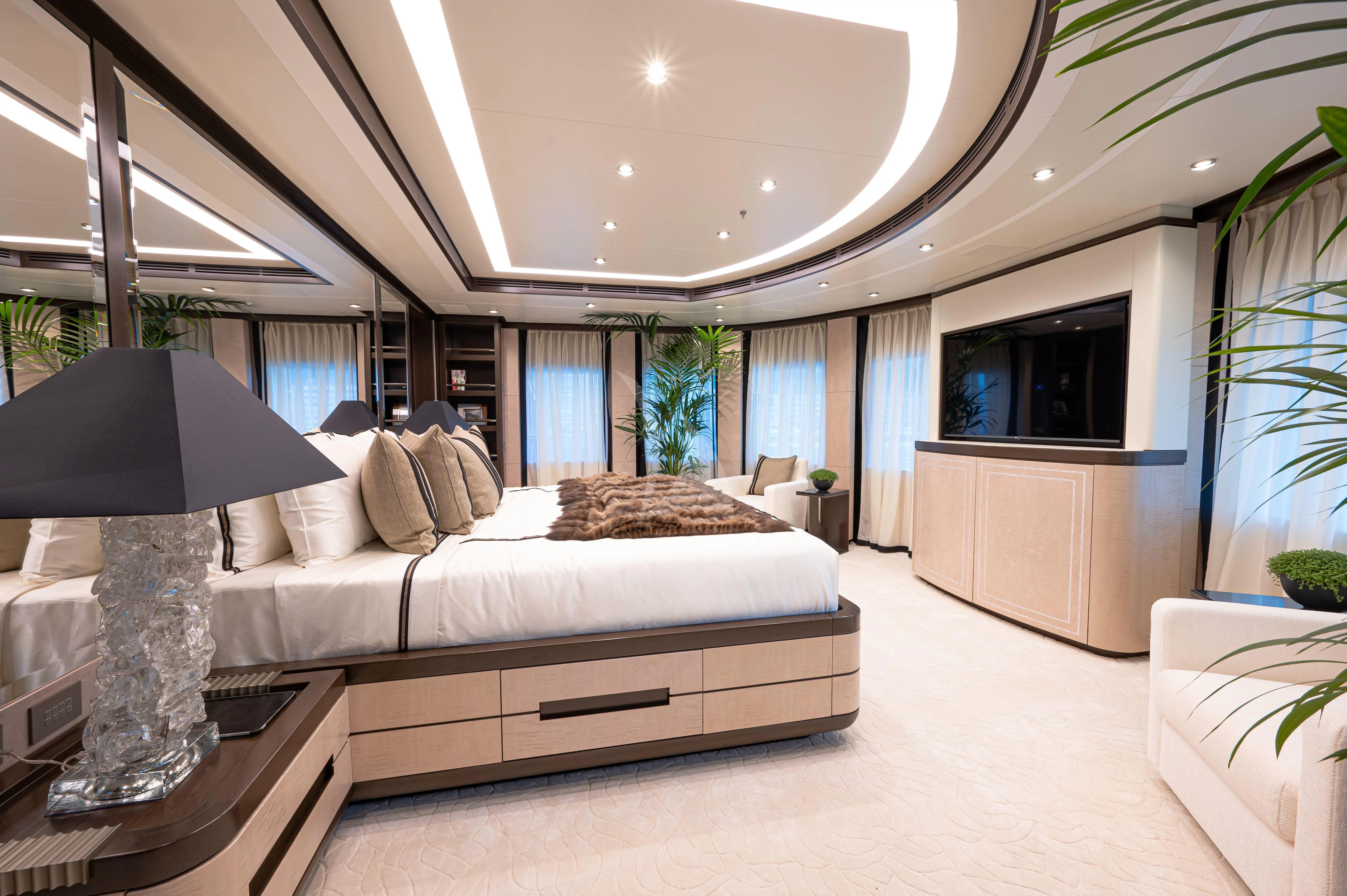 a large white couch in a living room aboard TRIUMPH Yacht for Sale