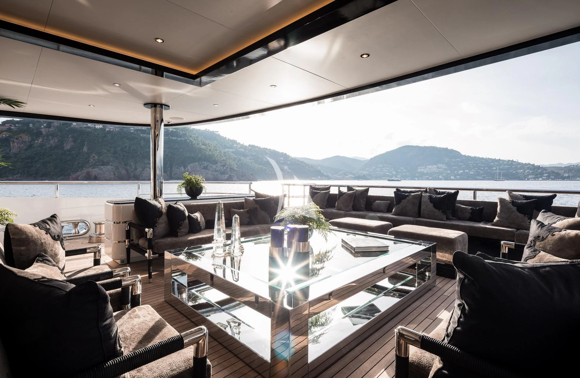 a large room with a table and chairs aboard TRIUMPH Yacht for Sale