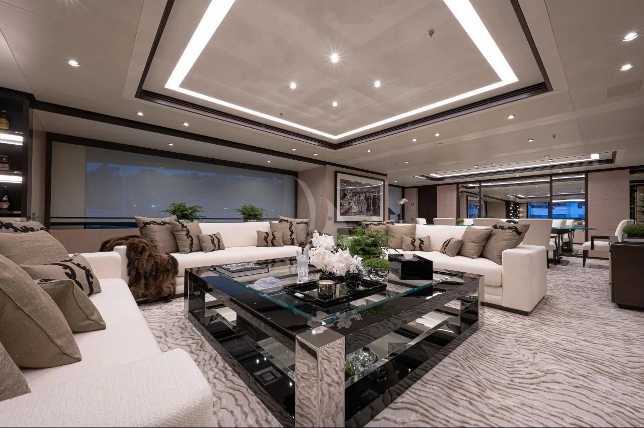 a living room with white couches aboard TRIUMPH Yacht for Sale