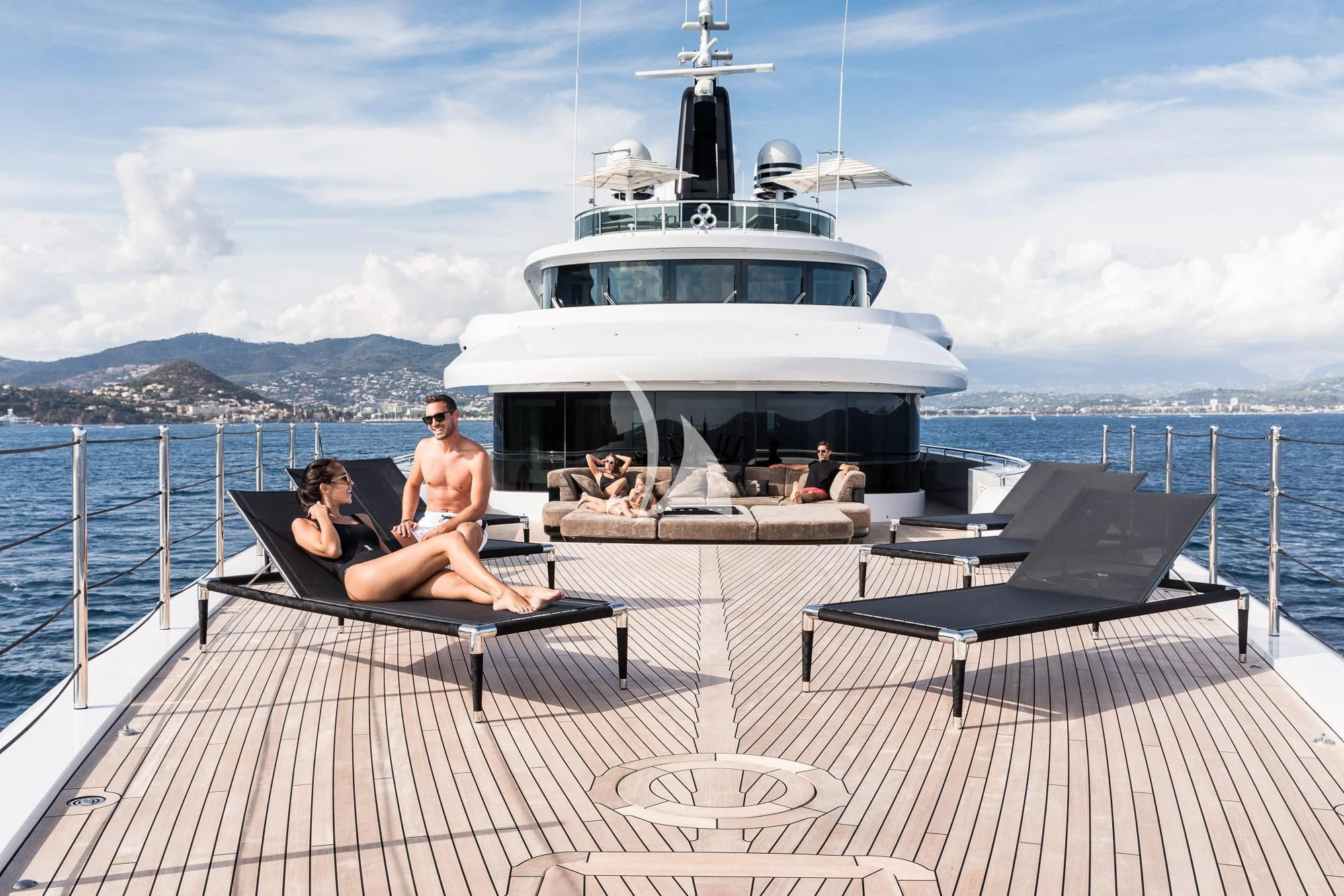 a couple sitting on a boat aboard TRIUMPH Yacht for Sale