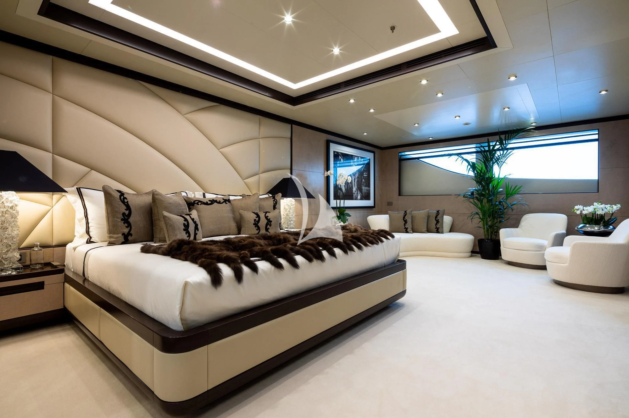 a large bed in a room aboard TRIUMPH Yacht for Sale