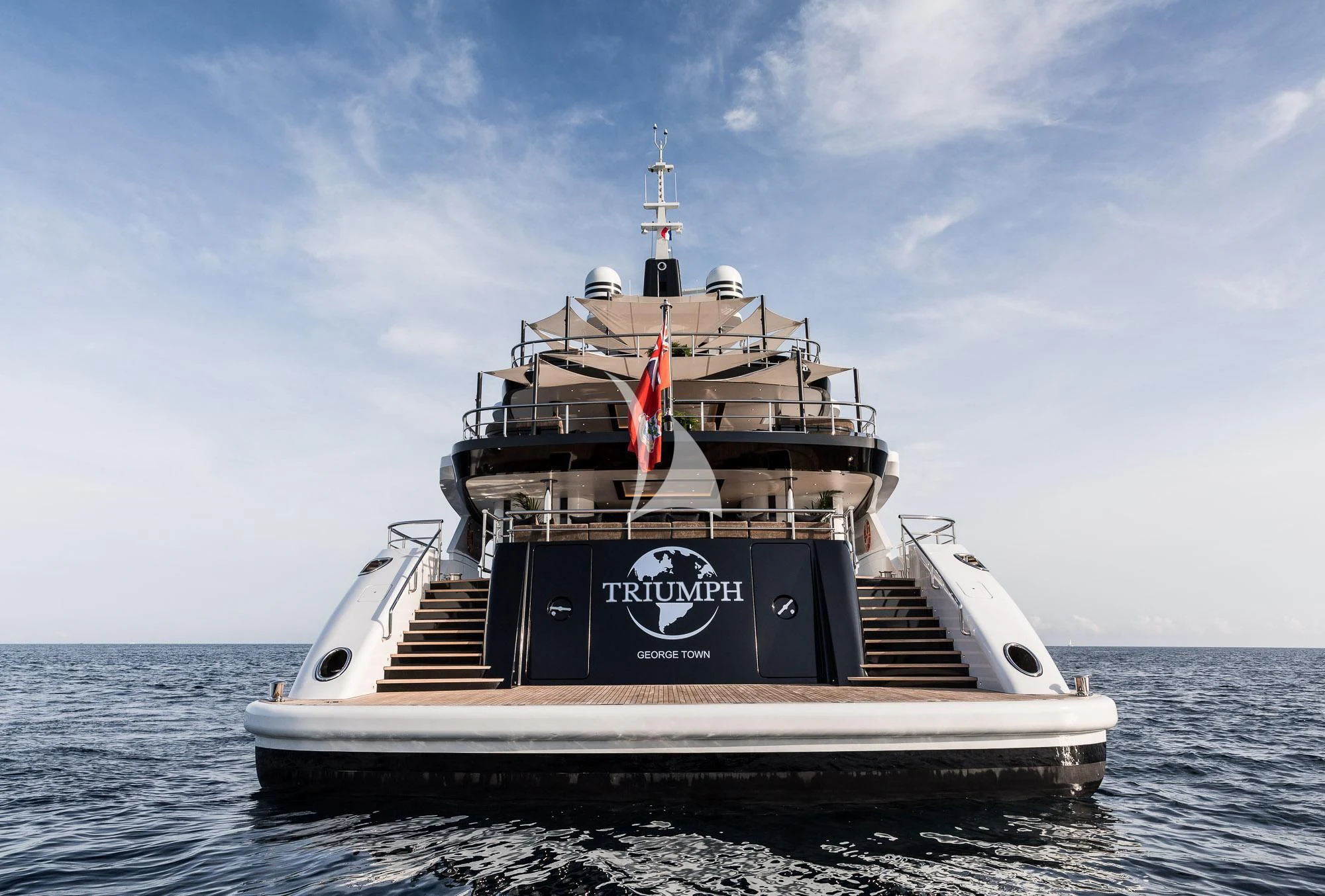 a large ship in the water aboard TRIUMPH Yacht for Sale