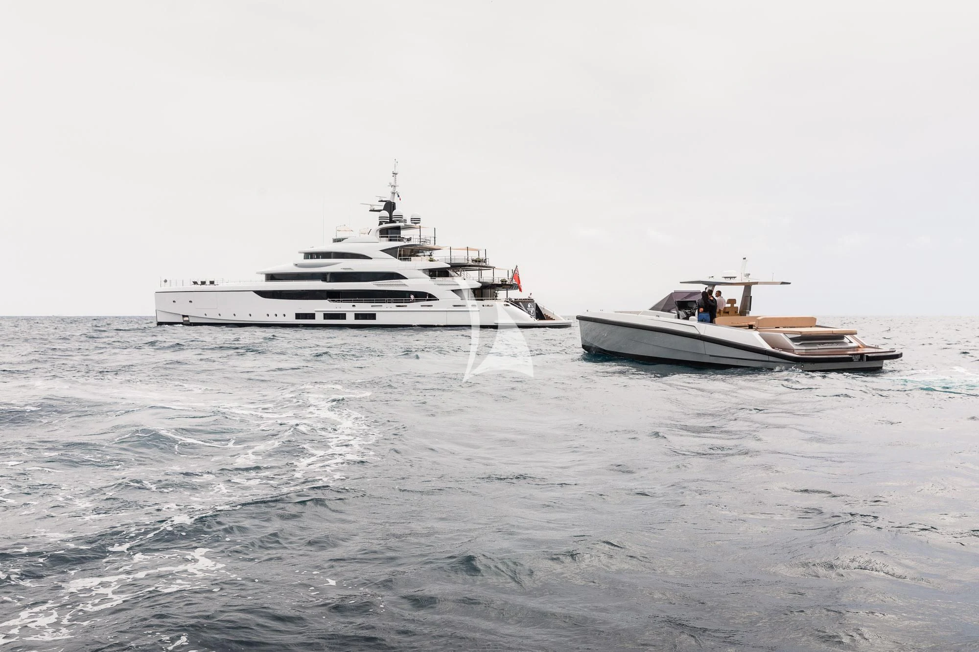a couple of boats in the ocean aboard TRIUMPH Yacht for Sale