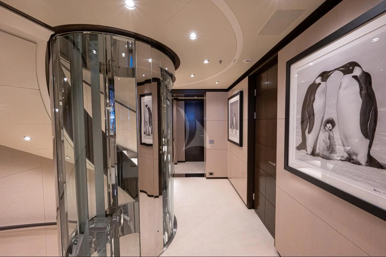 a hallway with glass doors aboard TRIUMPH Yacht for Sale