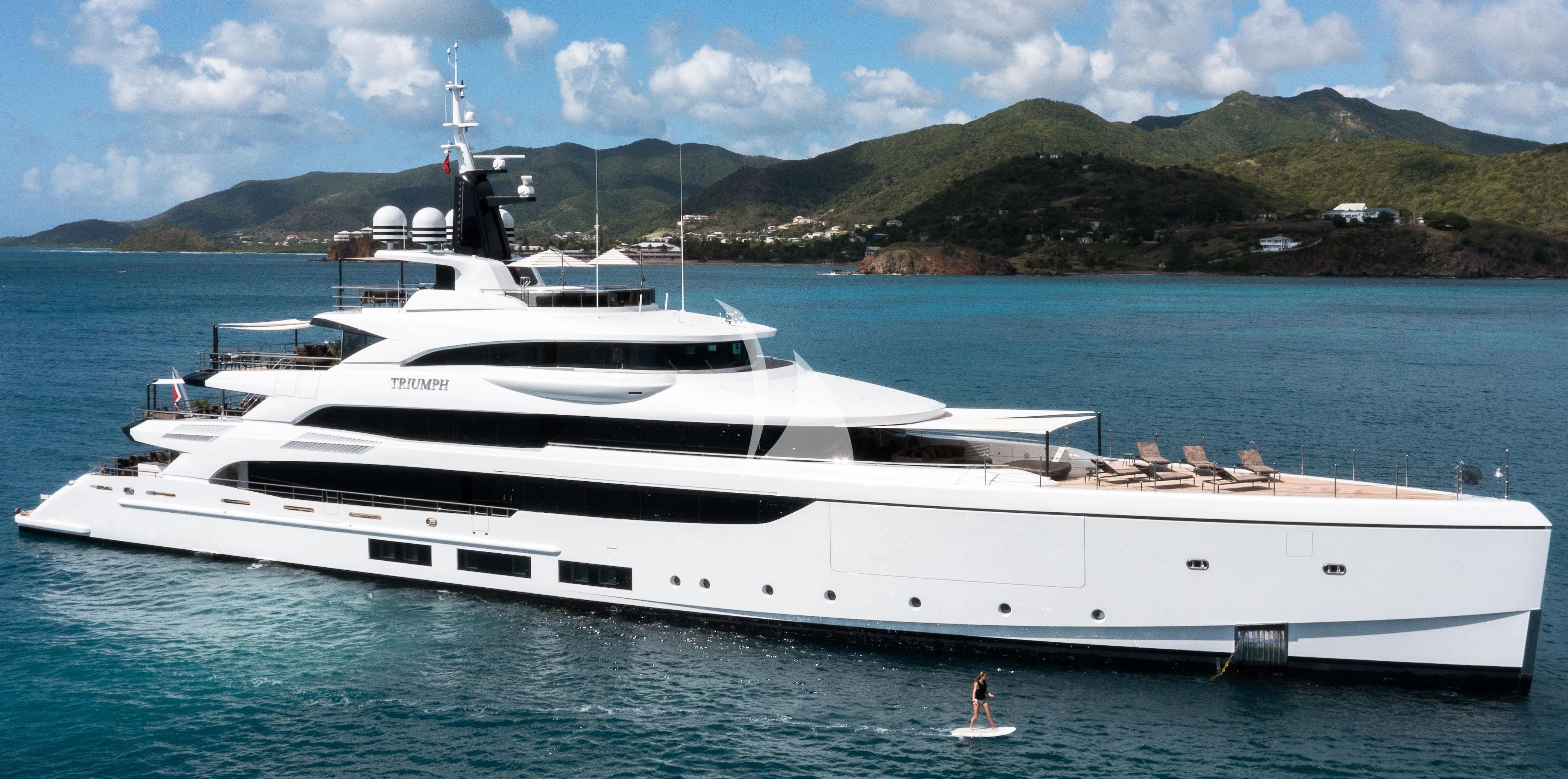 a white yacht in the water aboard TRIUMPH Yacht for Sale