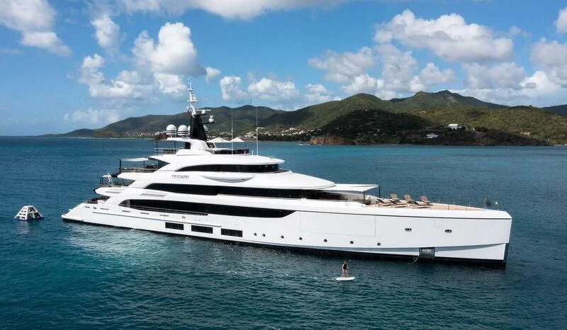 a large white yacht in the water aboard TRIUMPH Yacht for Sale