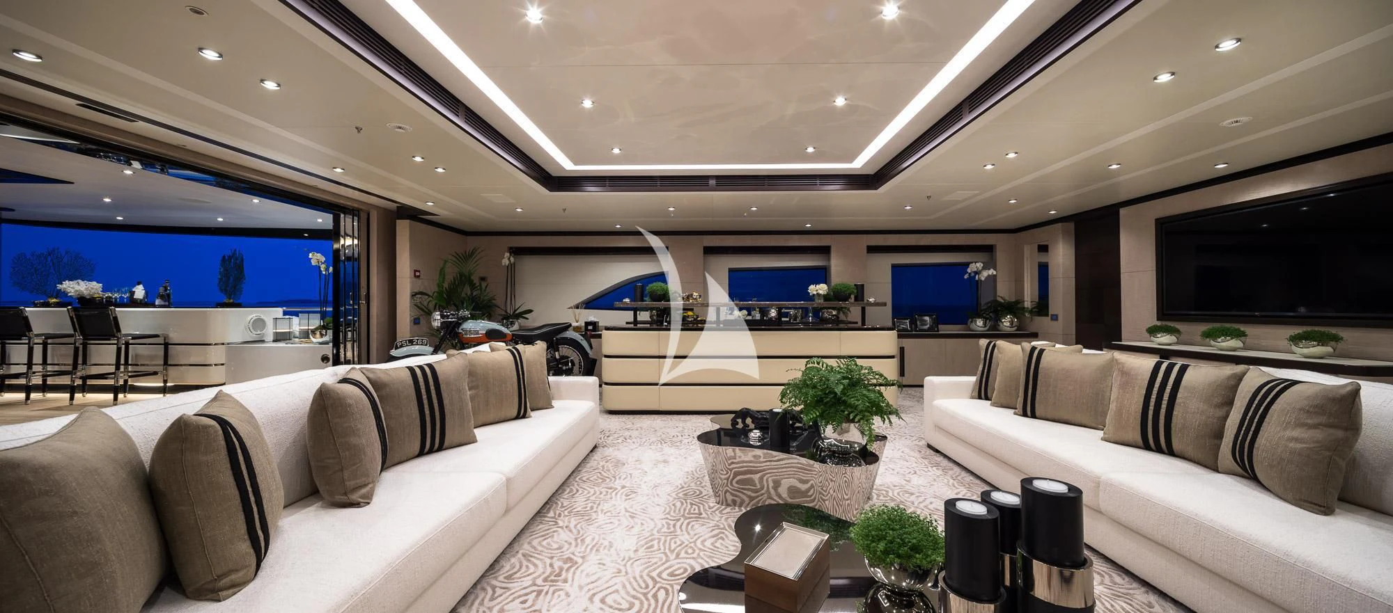 a living room with couches and a tv aboard TRIUMPH Yacht for Sale