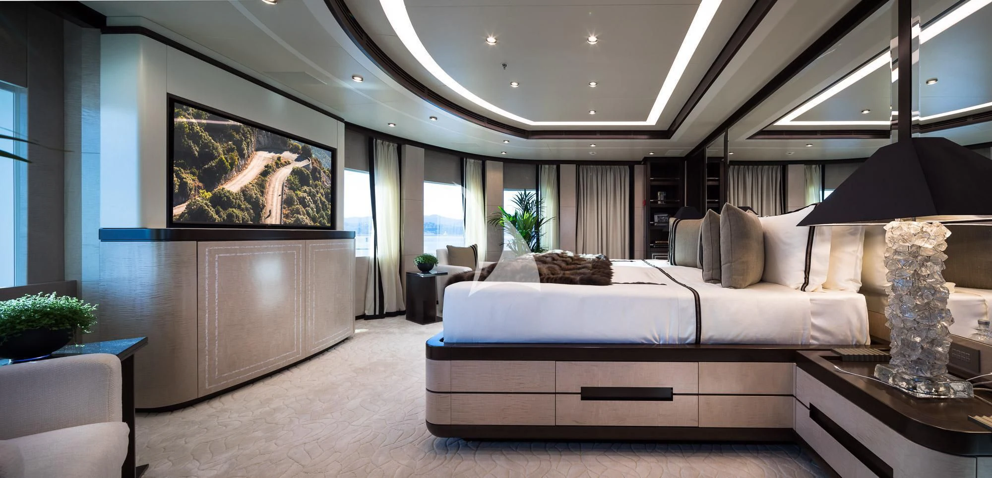 a large modern bedroom aboard TRIUMPH Yacht for Sale