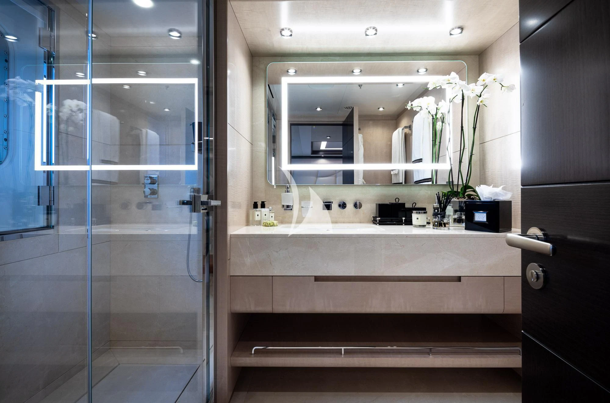 a bathroom with a glass shower aboard TRIUMPH Yacht for Sale