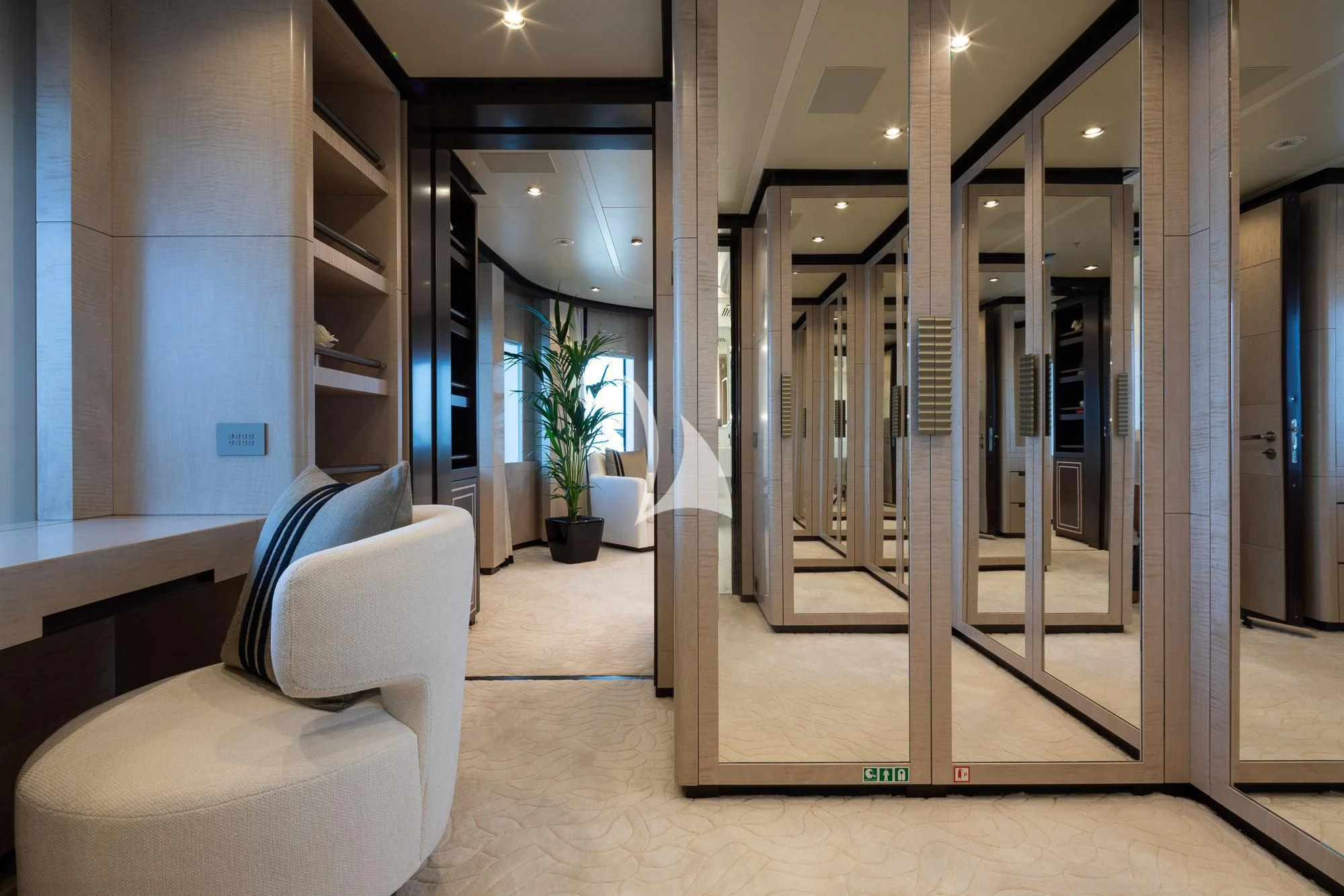 a room with a chair and a glass door aboard TRIUMPH Yacht for Sale
