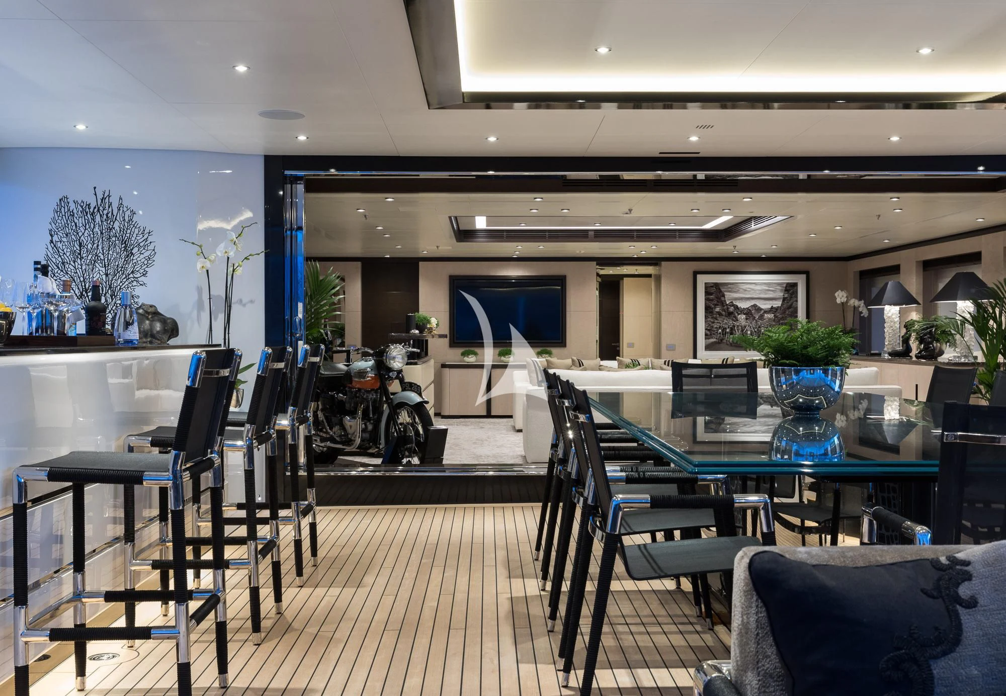 a room with a table chairs and a bike aboard TRIUMPH Yacht for Sale