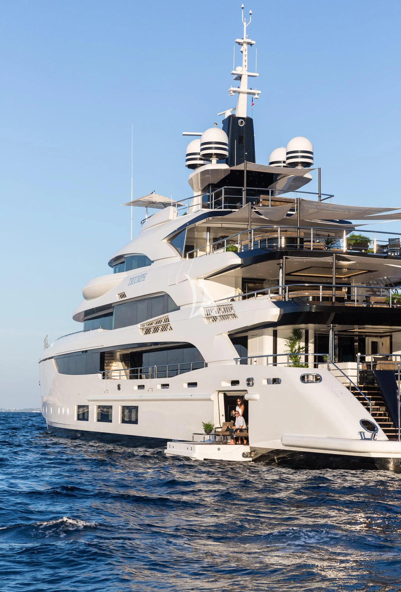 a large white boat in the water aboard TRIUMPH Yacht for Sale