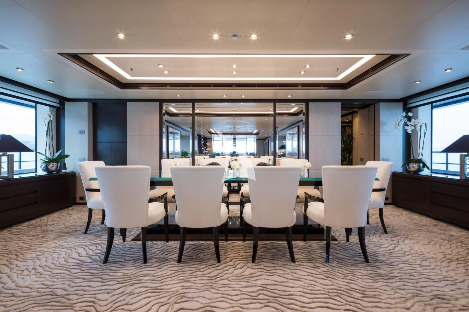 a large room with chairs and a table aboard TRIUMPH Yacht for Sale