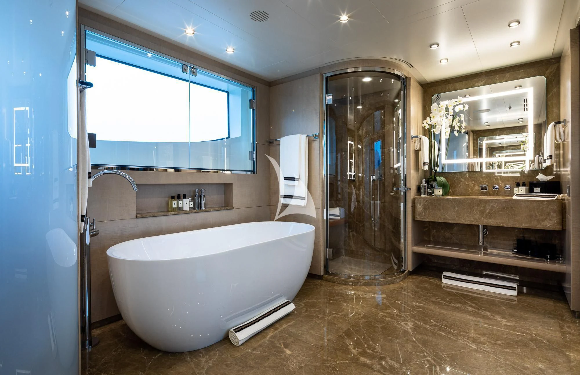 a bathroom with a tub and a sink aboard TRIUMPH Yacht for Sale