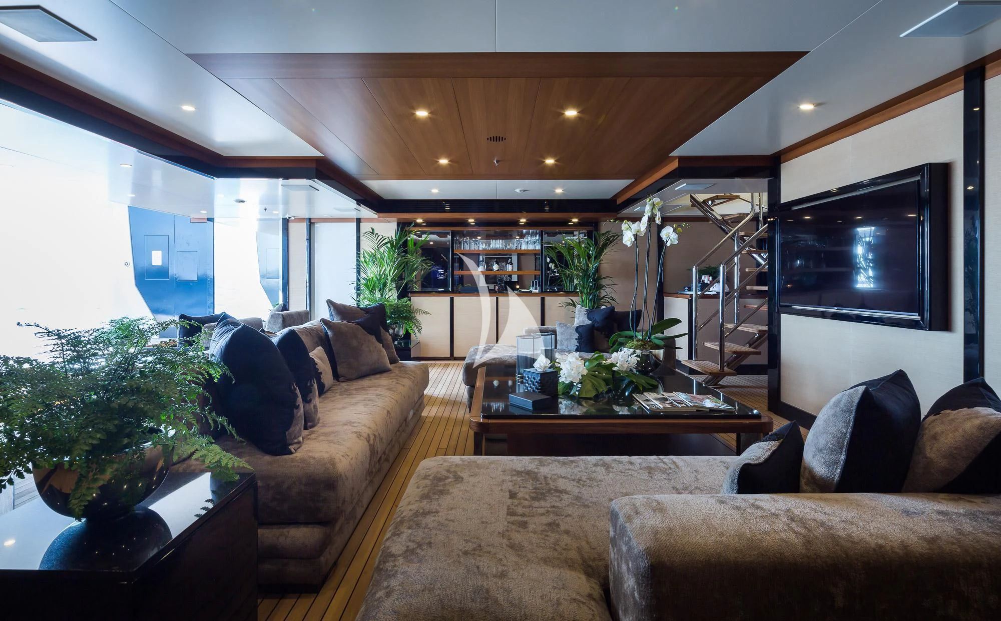 a living room with a large tv aboard TRIUMPH Yacht for Sale