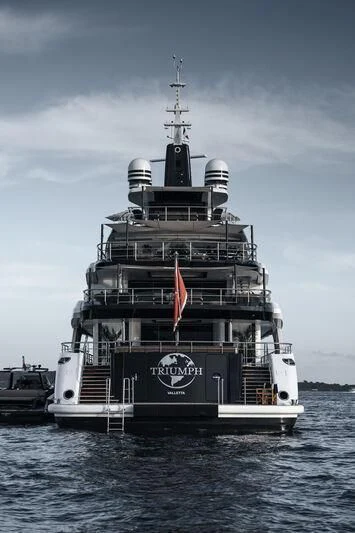 a large ship in the water aboard TRIUMPH Yacht for Sale