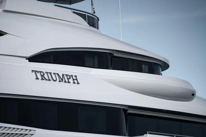 a white yacht with a black roof aboard TRIUMPH Yacht for Sale
