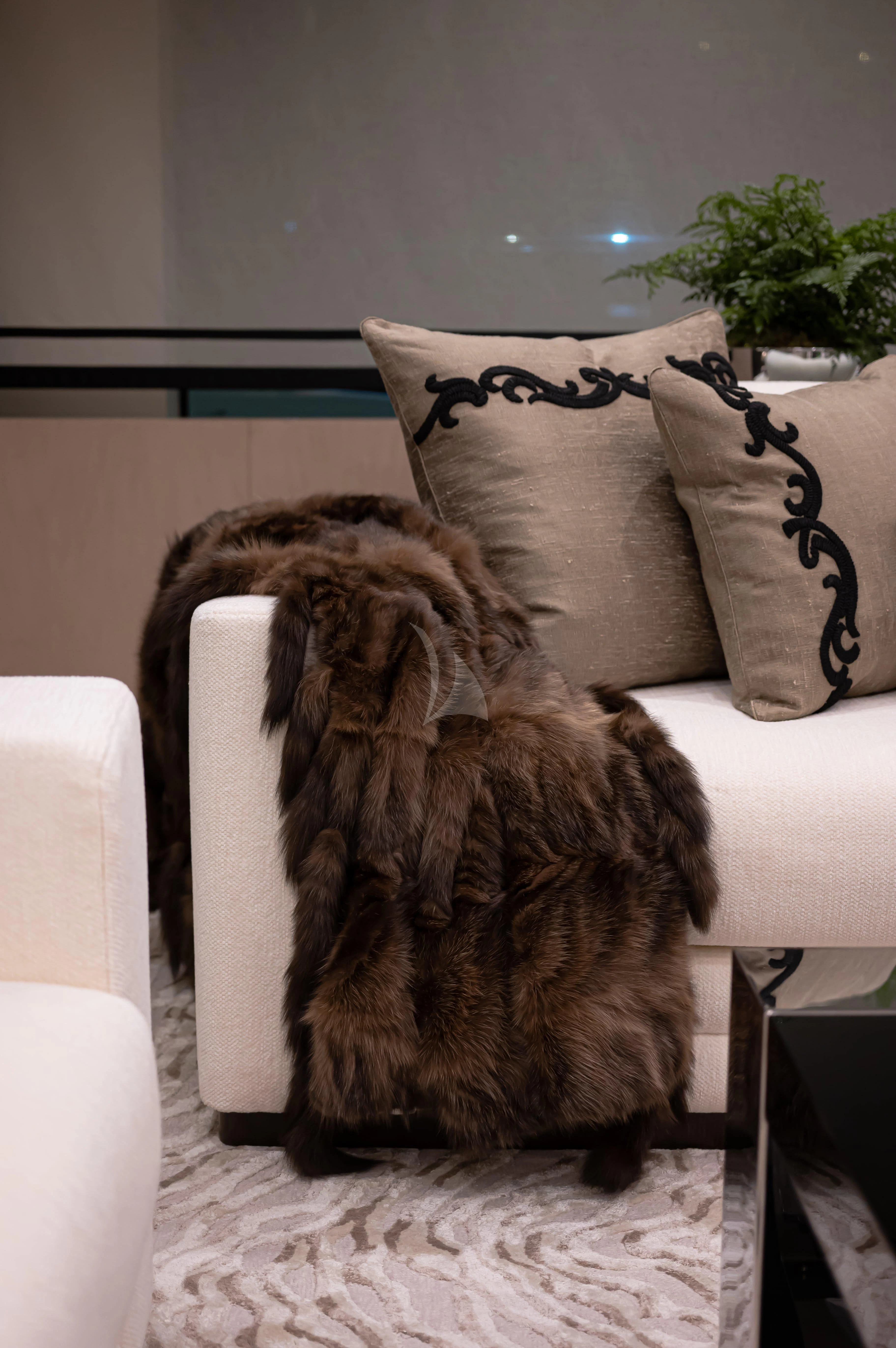 a cat sitting on a couch aboard TRIUMPH Yacht for Sale