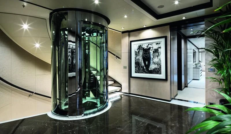 a large glass cylinder in a room aboard TRIUMPH Yacht for Sale