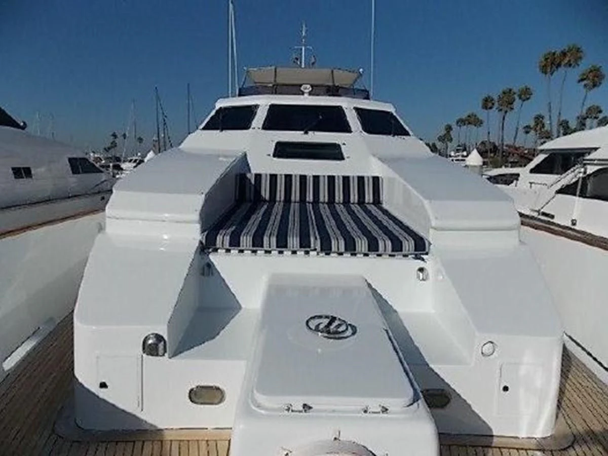 a white yacht on a dock aboard SILVER SPIRIT II Yacht for Sale