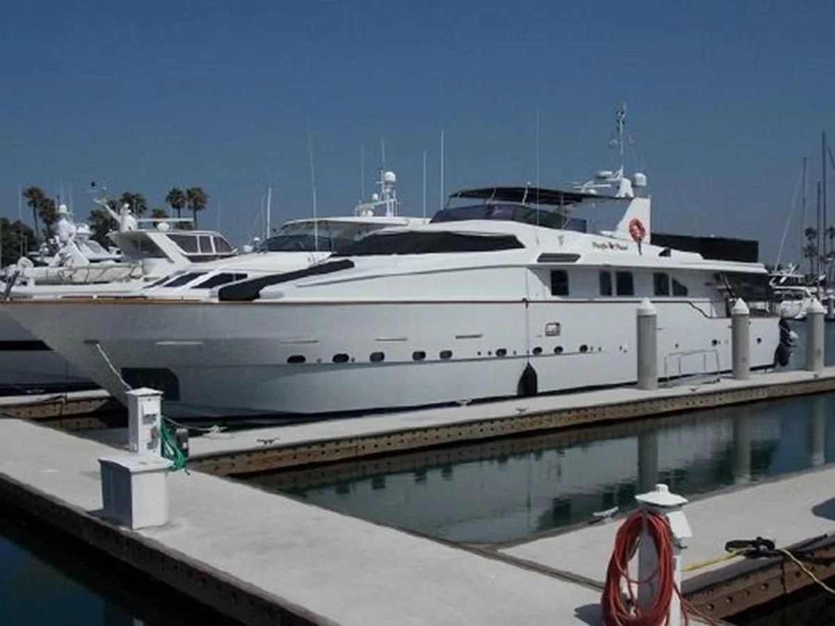 a white yacht docked at a dock aboard SILVER SPIRIT II Yacht for Sale