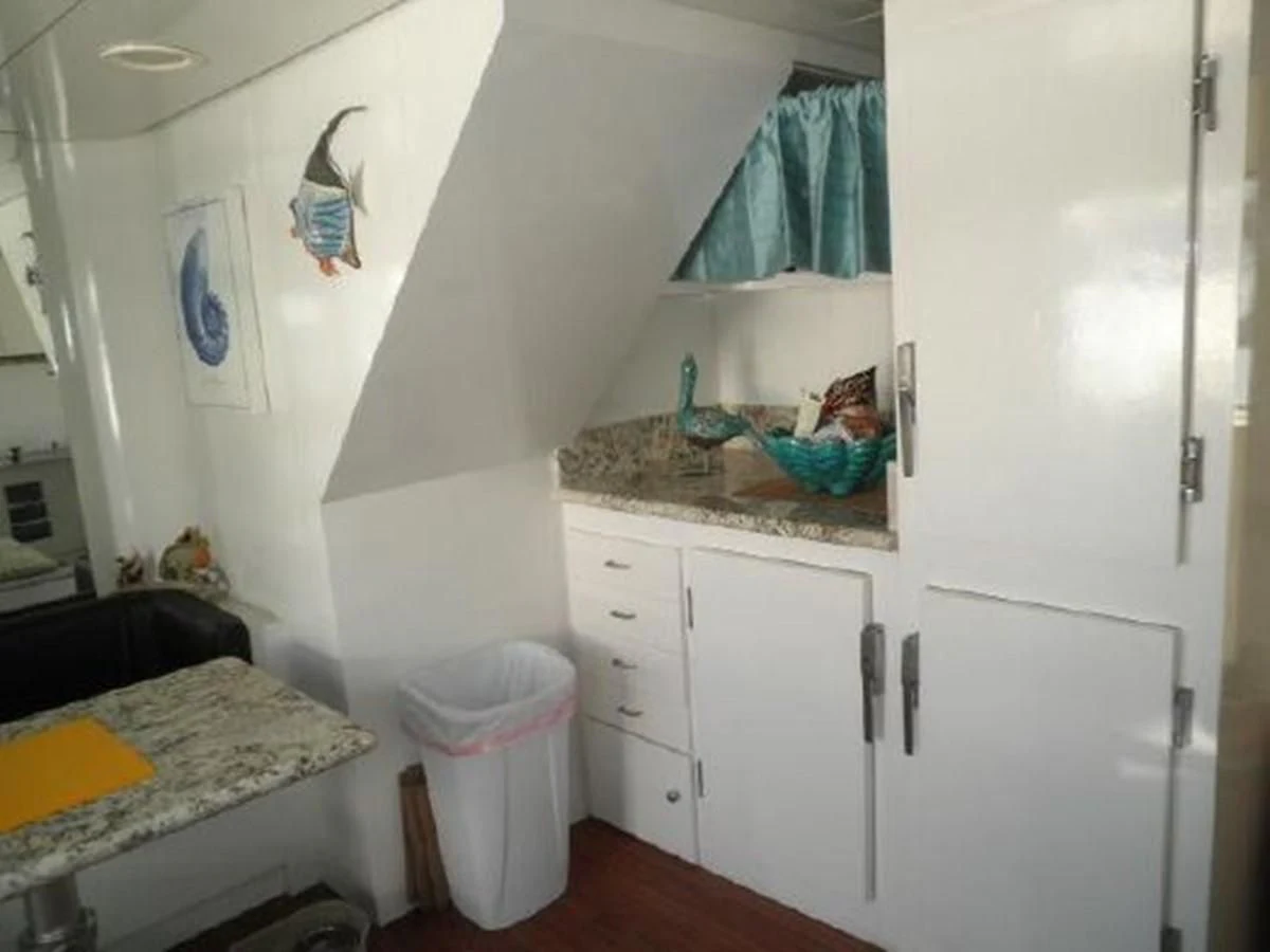 a small bathroom with a sink and a bed aboard SILVER SPIRIT II Yacht for Sale