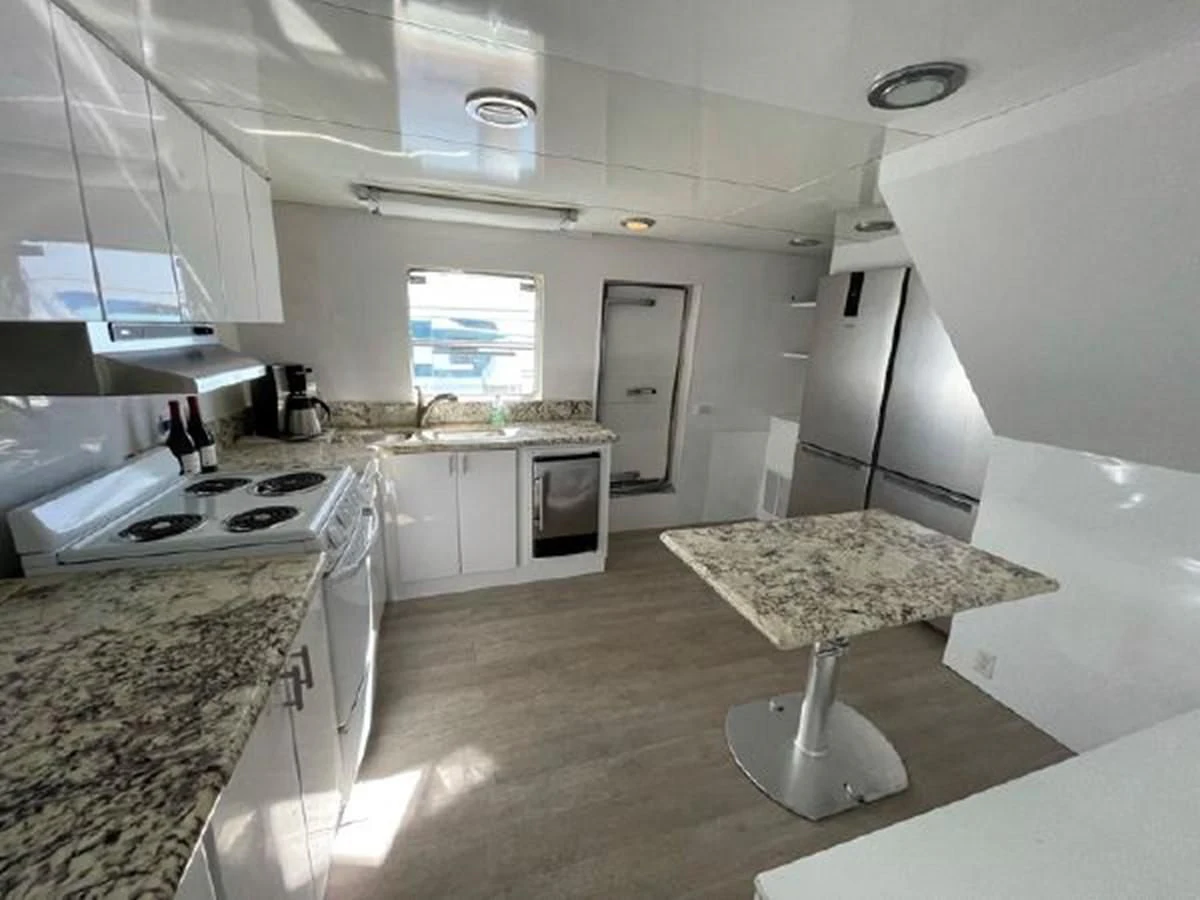 a kitchen with a large island aboard SILVER SPIRIT II Yacht for Sale
