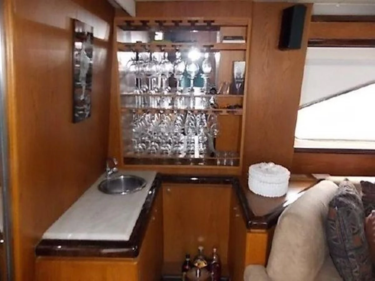 a room with a table and chairs aboard SILVER SPIRIT II Yacht for Sale
