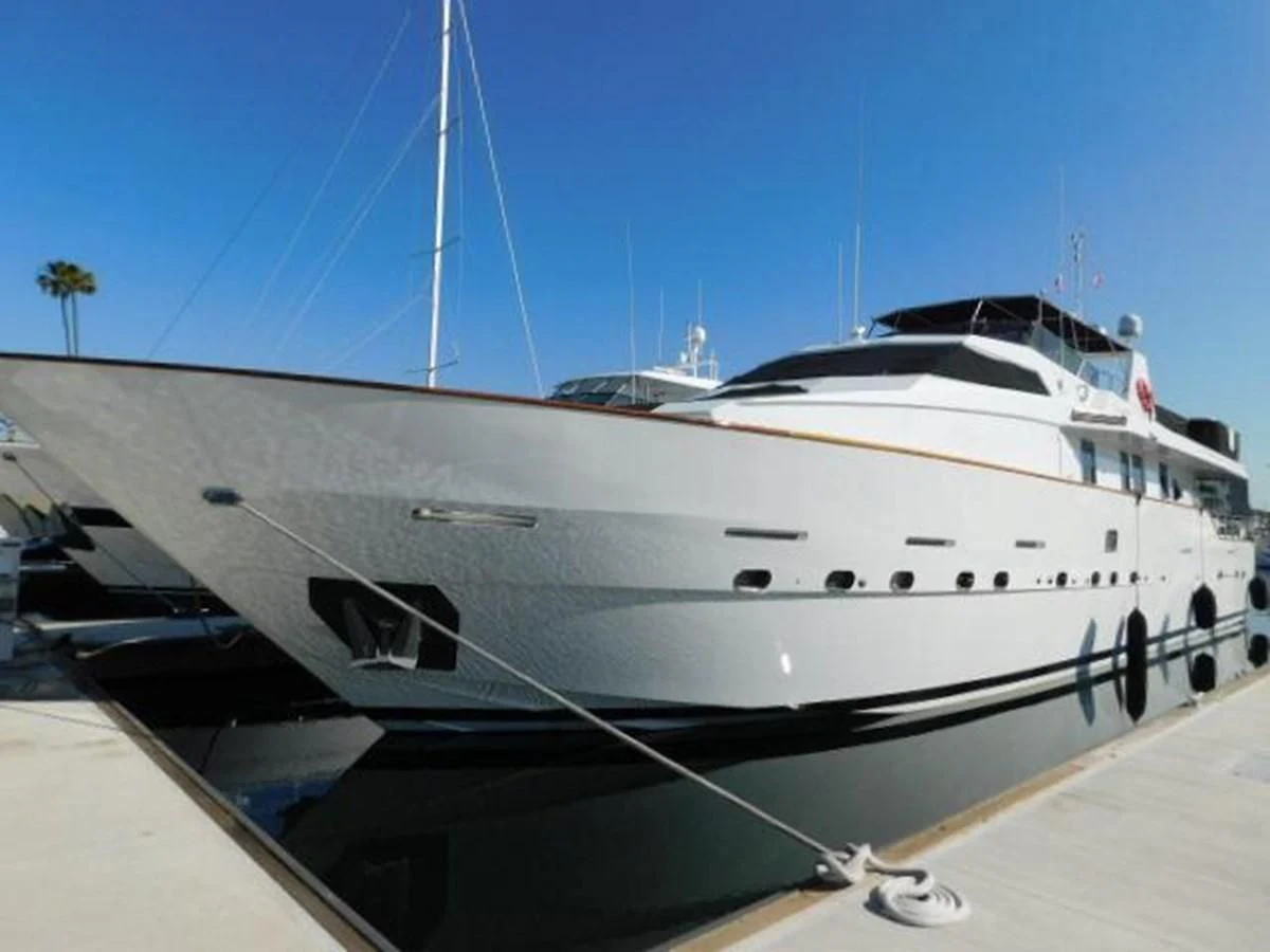 a white yacht on a dock aboard SILVER SPIRIT II Yacht for Sale