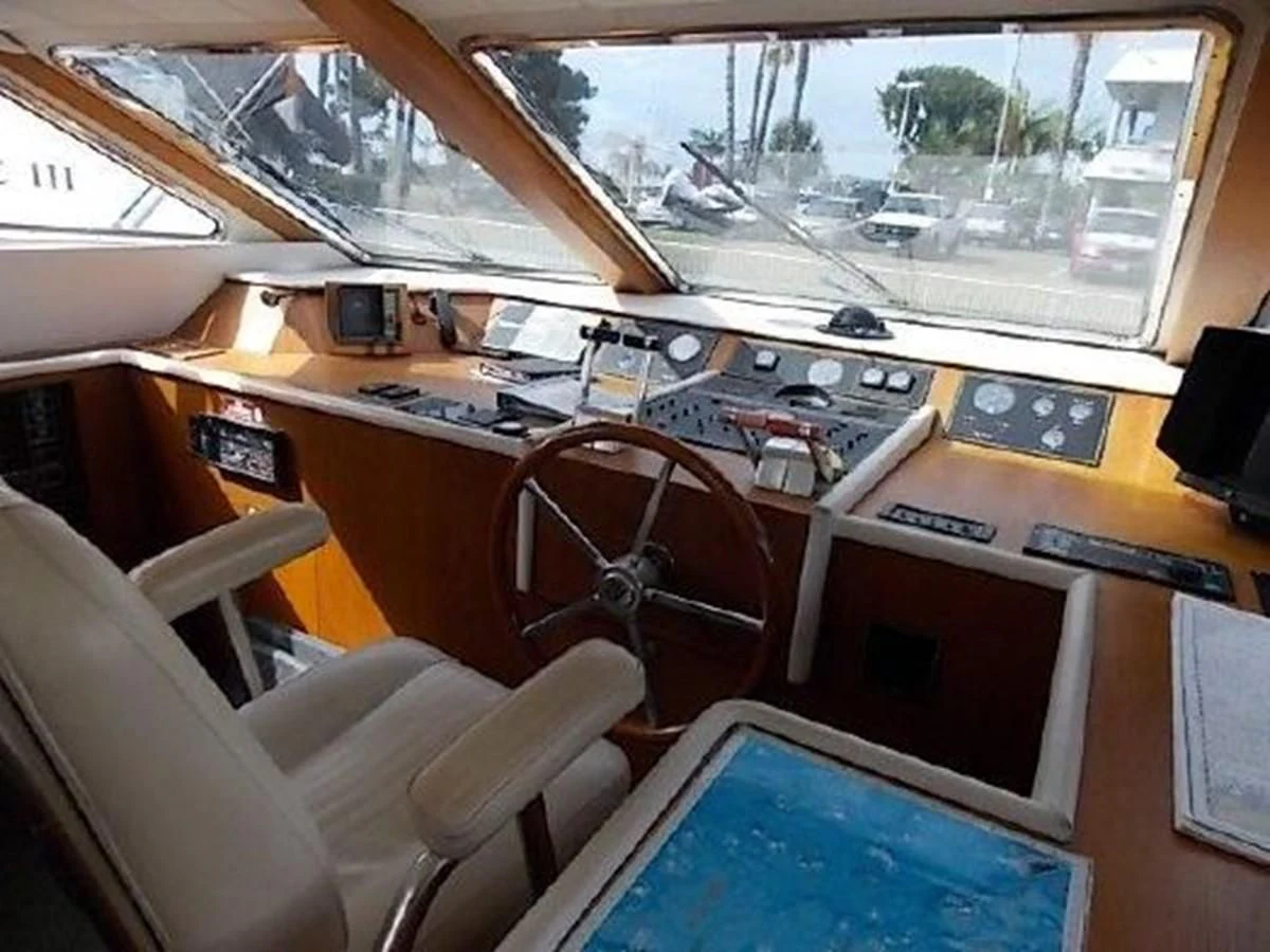 a room with a desk and chairs aboard SILVER SPIRIT II Yacht for Sale