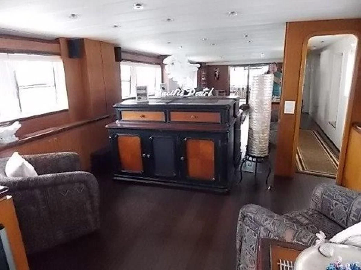 a living room with a fireplace aboard SILVER SPIRIT II Yacht for Sale