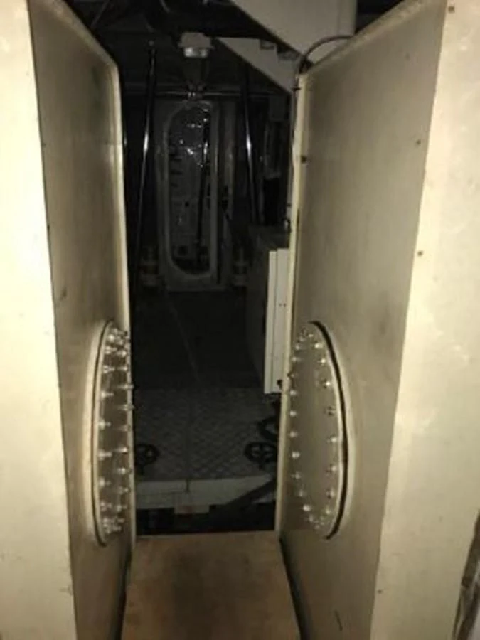 a hallway with a door open aboard SILVER SPIRIT II Yacht for Sale