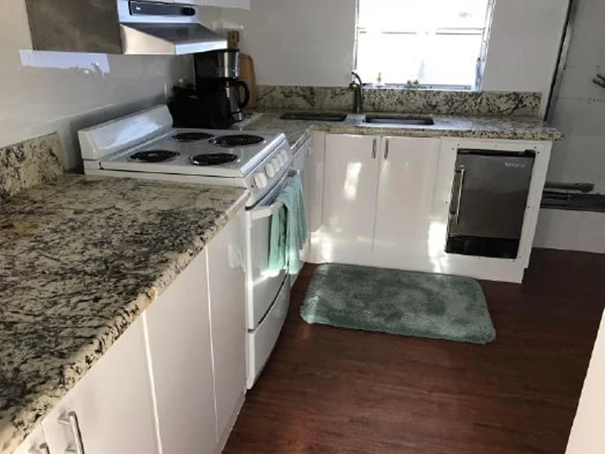 a kitchen with a stove and a sink aboard SILVER SPIRIT II Yacht for Sale