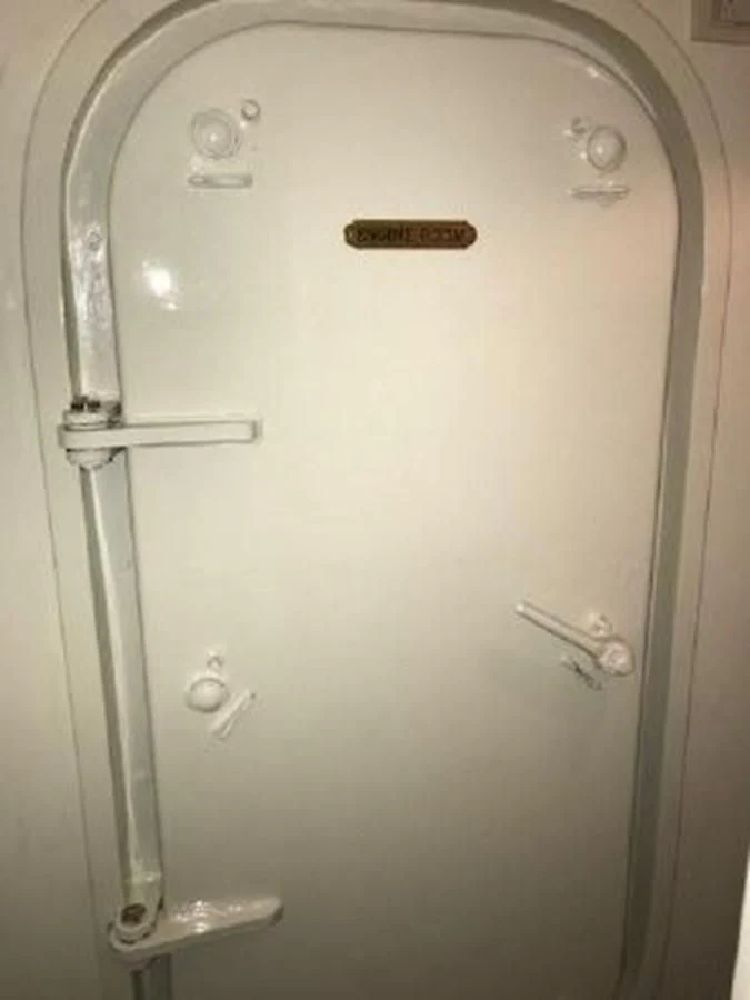 a white door with knobs aboard SILVER SPIRIT II Yacht for Sale