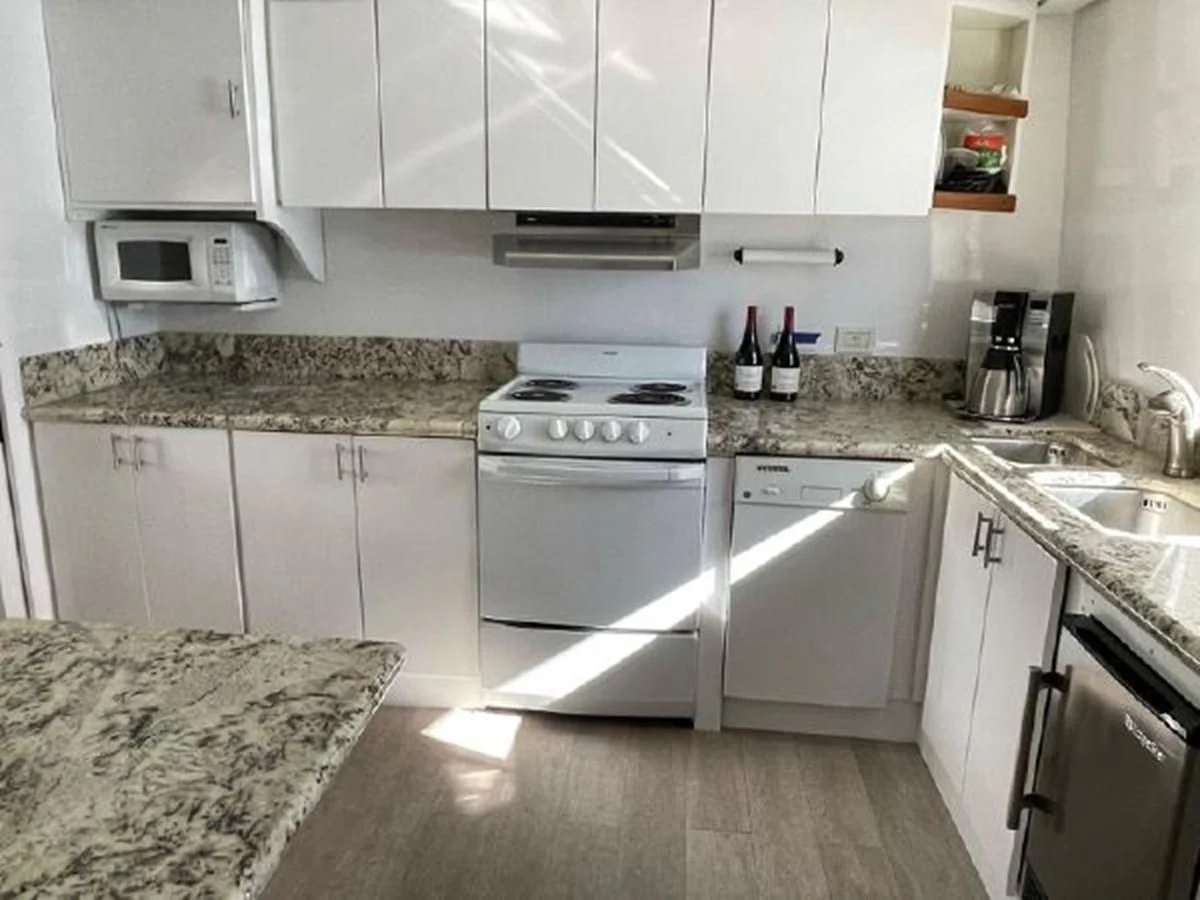 a kitchen with white cabinets aboard SILVER SPIRIT II Yacht for Sale