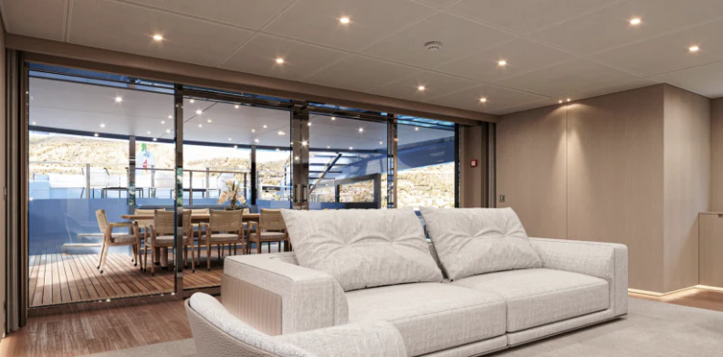 a living room with a couch and a table aboard BEL 1 Yacht for Sale