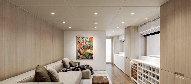 a living room with a couch and a bookcase aboard BEL 1 Yacht for Sale