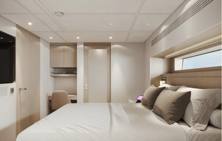 a large white bedroom with a large bed and a white wall aboard BEL 1 Yacht for Sale