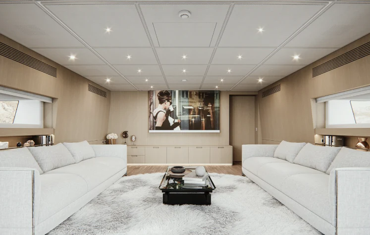 a person standing in a living room aboard BEL 1 Yacht for Sale