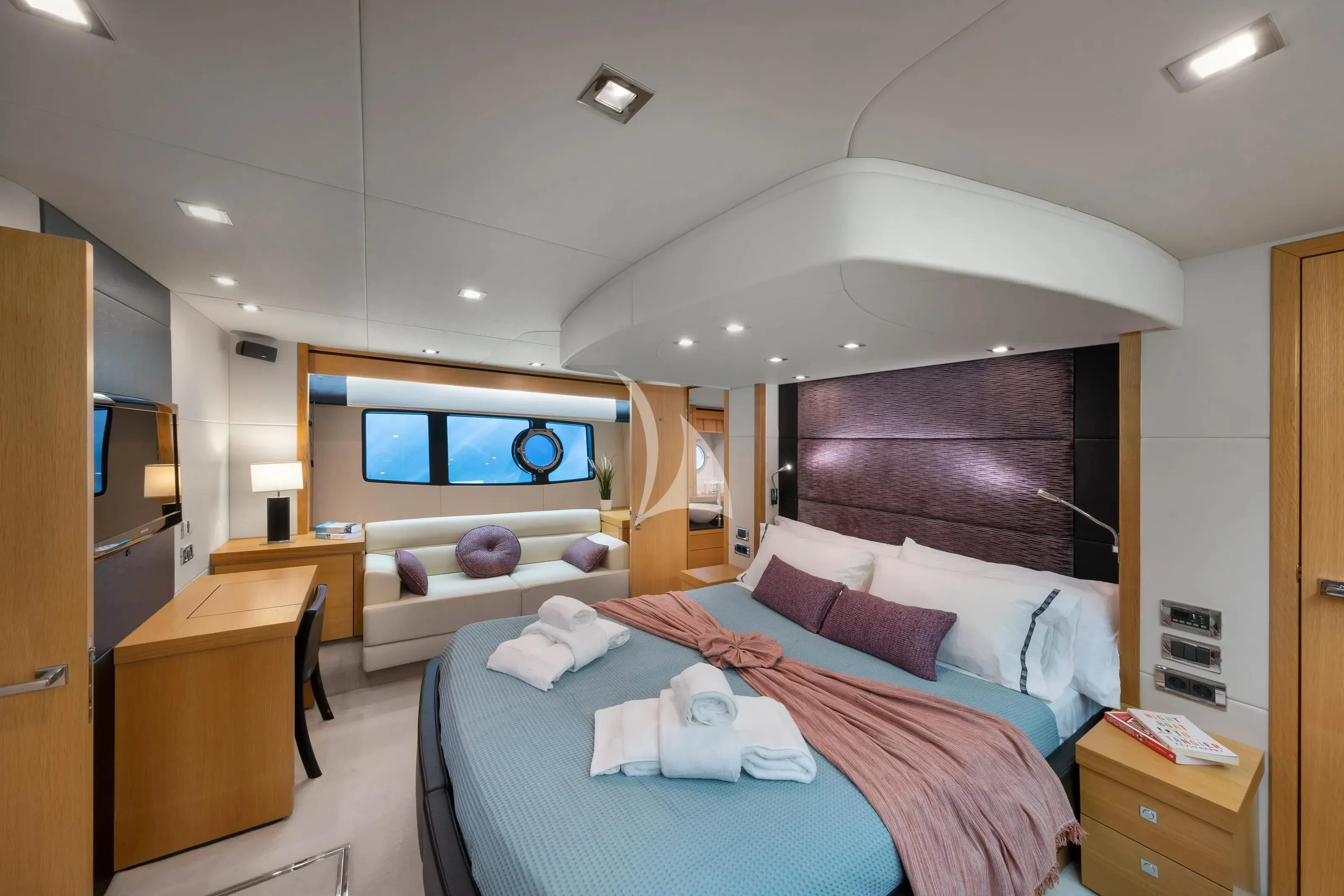 a bedroom with a bed and a desk aboard POLPO Yacht for Charter