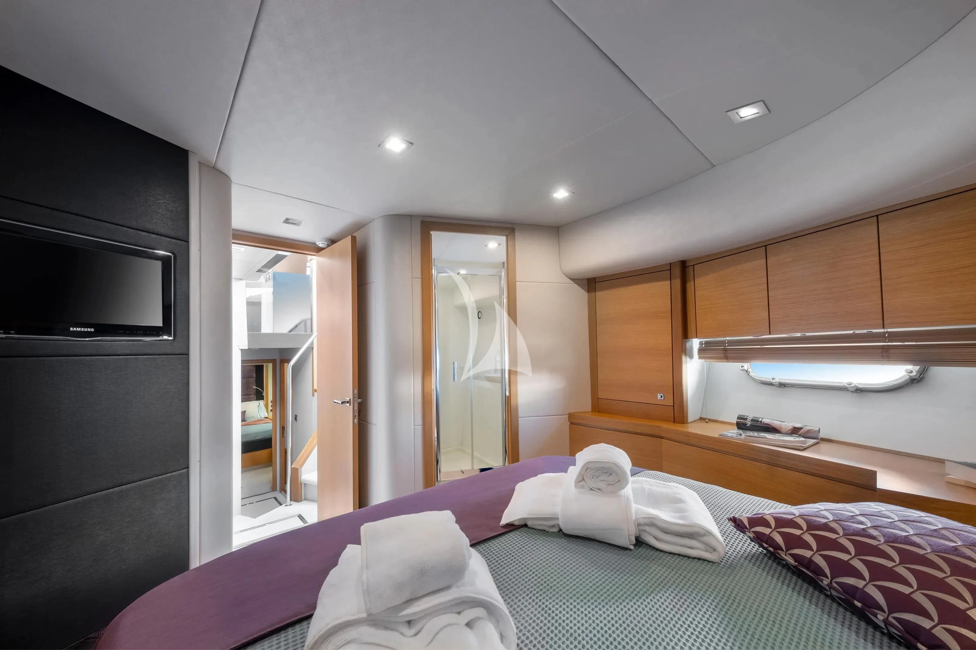 a bedroom with a bed and a microwave aboard POLPO Yacht for Charter