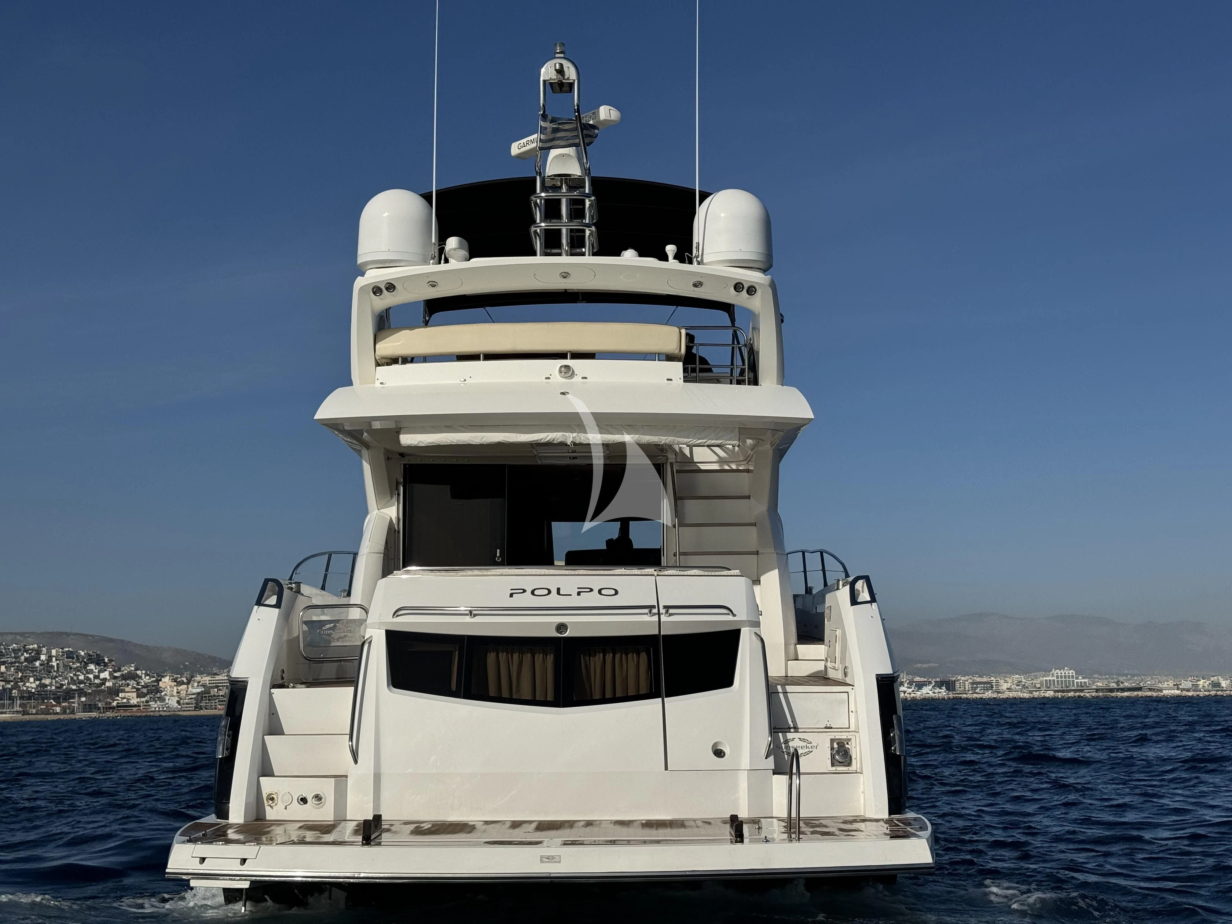 a white boat in the water aboard POLPO Yacht for Charter