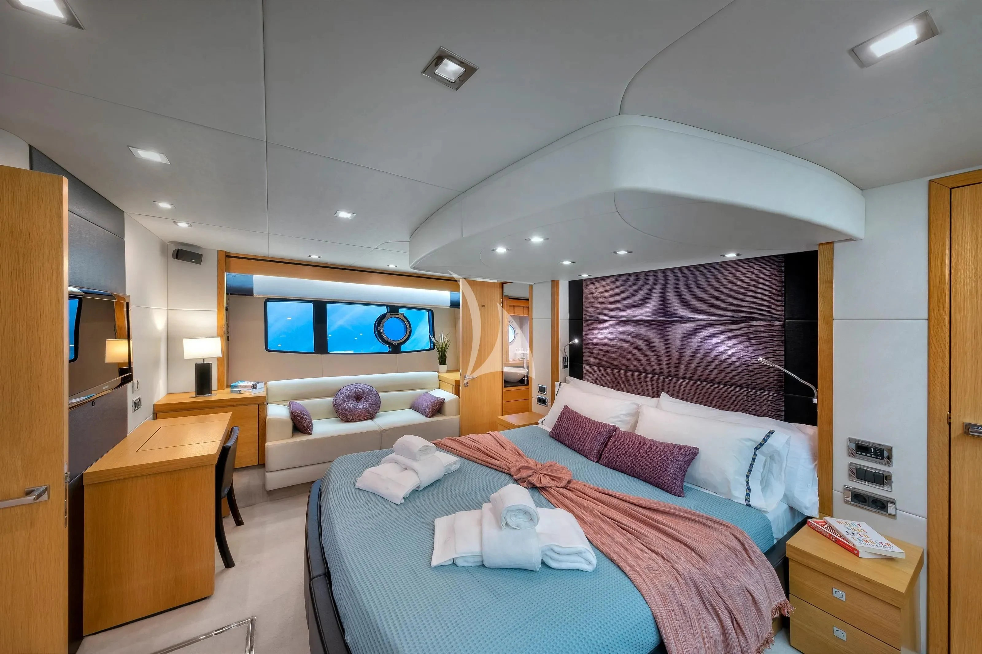 a bedroom with a bed and a desk aboard POLPO Yacht for Charter